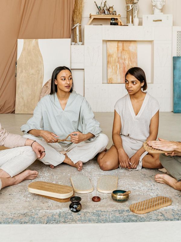 A spacious, well-lit room prepared for a yoga session.